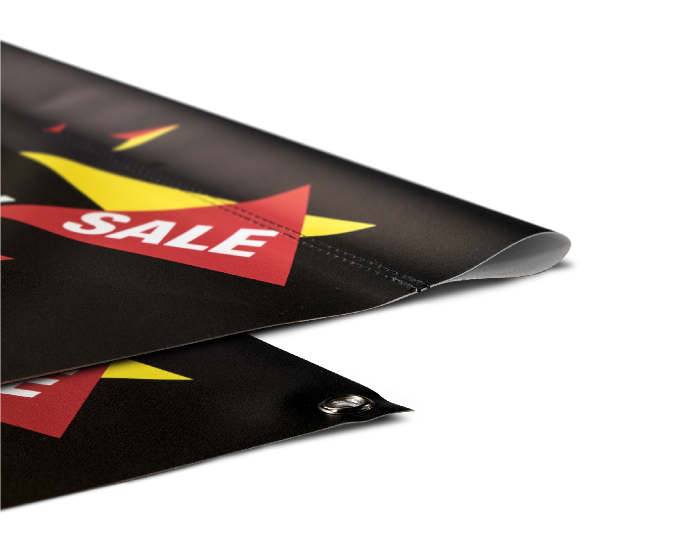 Two banners, one with a pole pocket and one with grommets